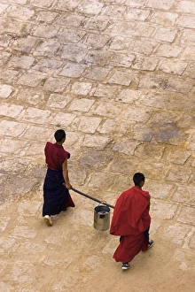 Tibet Gallery: Monks carrying yak butter, Ganden Monastery, Tagtse county, Tibet