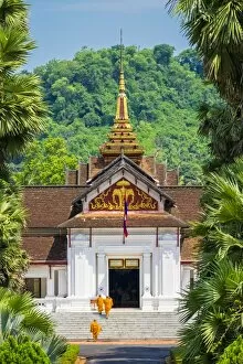 Royal Palace Collection: Monks entering Royal Palace Museum in Luang Prabang, Louangphabang Province, Laos