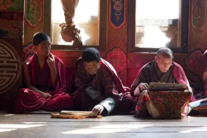 Monks at the sacred thread ceremony for the deceased in the monestery un Ura, Bumthang