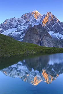 The Mont Blanc is reflected in Lac Checrouit during sunrise. Checrouit Lake, Veny Valley The Mont Blanc is reflected in Lac Checrouit during sunrise. Checrouit Lake, Veny Valley