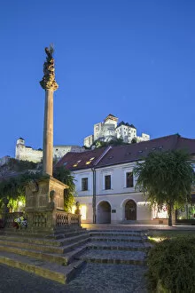 Images Dated 20th November 2013: Monument in Mierove Square and Trencin Castle at dusk, Trencin, Trencin Region, Slovakia