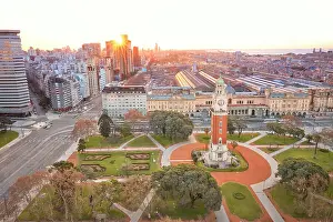 La Plata River Prints: The Monumental Tower with the Retiro Train Station and La Plata River in the background at sunset