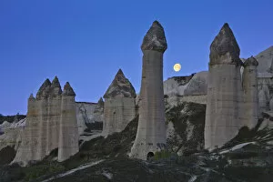 Moon over Fairy Chimneys in Honey Valley, near Goreme, Cappadocia, Turkey