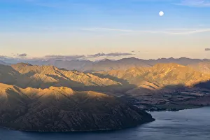 Moon over Lake Wanaka at sunset shot from Roys Peak track