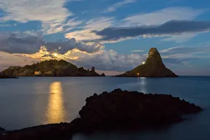 Lava Rock Prints: Moon that rises from the stacks of acitrezza in the east coast of Sicily, Italy