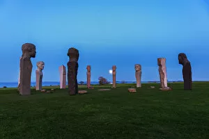 Images Dated 31st October 2022: Full moon rising behind the stone statues of Dodekalitten at dusk, Lolland island, Zealand, Denmark
