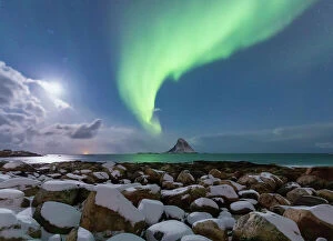 Images Dated 1st June 2023: Full moon in the sky and Northern lights over the island of Andoya, Andoeya, Bleik, Vesteralen
