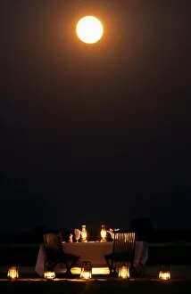 Zambesi Gallery: Moonlit dinner on an island in the middle of the Zambezi River