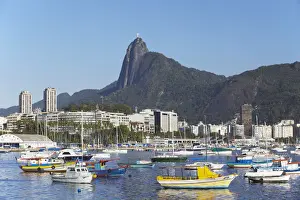 Corcovado Prints: Moored boats in harbour with Christ the Redeemer statue in background, Urca, Rio de