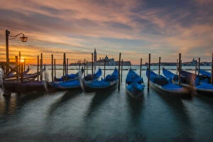 Images Dated 18th May 2015: Moored gondolas at sunrise with San Giorgio Maggiore island in the background, Venice