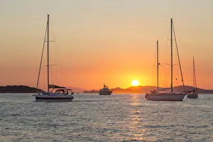 Orange Sky Prints: Mooring sailboats during the sunset, Ile de Porquerolles, Hyeres, Toulon, Var department