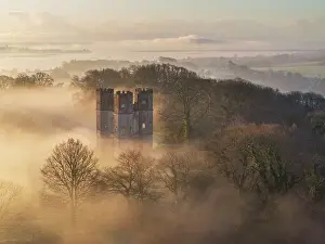 March Prints: Morning mist surrounds The Belvedere tower at dawn on a winter morning