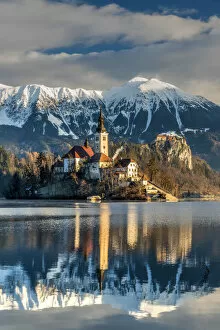 Images Dated 22nd December 2017: Morning sunlight over Church of the Assumption of Mary, Lake Bled, Upper Carniola