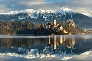 Images Dated 22nd December 2017: Morning sunlight over Church of the Assumption of Mary, Lake Bled, Upper Carniola