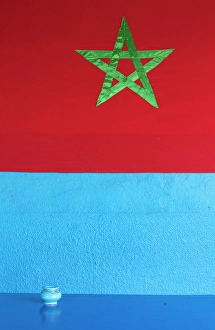 North African Prints: Moroccan flag on a blue wall, Khemlia, Erg Chebbi, near Merzouga, Morocco