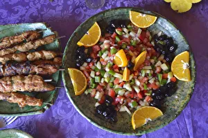 Traditions Prints: Moroccan salad and brochettes. Erg Chigaga sand dunes, Sahara desert. Morocco