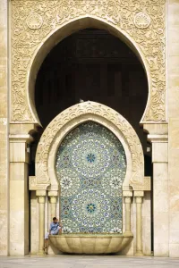 Sights Prints: MOROCCO, Casablanca A visitor is dwarfed by the towering