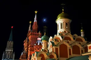 Moscow, Russia; Kazan Cathedral and towers from the History Museum in Red Square at night