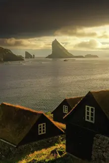 North Sea Prints: Some moss-covered houses with Drangarnir and Tindholmur sea stacks in the background