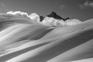Images Dated 18th May 2021: Mount Civetta emerges from the clouds over the slopes of Col Nudo after a heavy snowfall