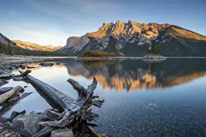 October Prints: Mount Inglismaldie reflected in the calm waters of Lake Minnewanka in Banff National Park
