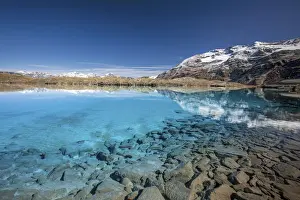 Mount Sobretta reflecting in the crystal clear water of Bei Laghetti - Alpi