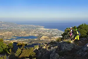 Cycling Prints: Mountain bikers in Stavros, Selakano overlooking Agios Nikolaos, Crete, Greece, Europe