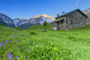 Dawns Prints: Mountain house at Alpe dell Oro with Mount Disgrazia in the background. Chiareggio