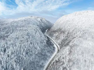 Snow Flurry Prints: Mountain road with snow, Dixville Notch, New Hampshire, USa