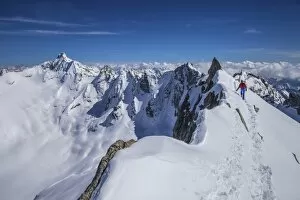 Mountaineer at Canton peak, Forno valley, Switzerland
