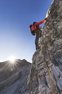 Mountaineer along the via ferrata on the north side of mount Gr. Kinigat, Kartitsch