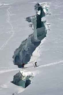 Mountaineers crossing crevasse (Monte Rosa), Aosta Valley, Italy, Europe