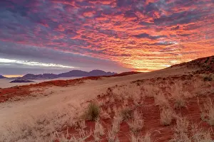 Sand Dunes Prints: Mountains and sand dunes at sunset, Namib Rand Nature Reserve, Namib Desert, Namibia