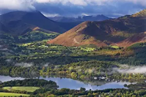 Backdrop Prints: Mountains and woodland form a backdrop to Derwent Water in the Lake District