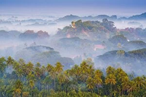 Images Dated 24th December 2015: Mrauk-U, Rakhine state, Myanmar. Mrauk-U valley in a foggy sunrise seen from the