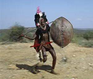 Maasai Tribe Collection: A Msai warrior in full battle cry