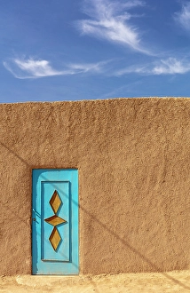 Mud Wall Prints: Mud wall and painted door, Merzouga, Morocco