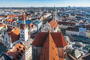 Frauenkirche Prints: Munich, Germany. Aerial view of iconic Bavarian architecture and rooftops under a clear blue sky
