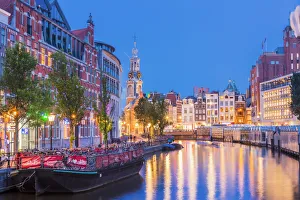 Amsterdam Gallery: Munttoren tower reflecting in the water canal by night in Amsterdam, Holland / Netherlands