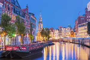 Urban Landscape Prints: Munttoren tower reflecting in the water canal by night in Amsterdam, Holland / Netherlands