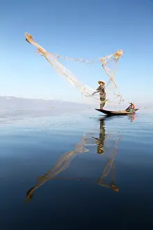 Shan State Prints: Myanmar, Burma, Shan, Fisherman casting his net on Inle Lake