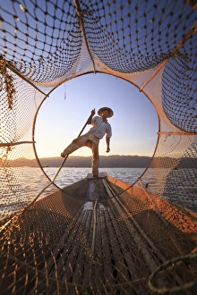 Myanmar (Burma), Shan State, Inle Lake, local fishermen at sunset