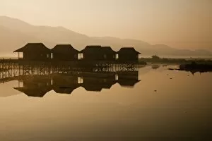 Sun Rise Gallery: Myanmar, Inle Lake. A misty dawn at Golden Island Cottages, a resort for tourists owned by
