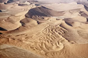 Namib Desert Gallery: The Namib is an immense expanse of relentlessly moving gravel plains and dunes of