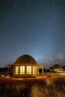 Lodge Gallery: Namibia, illuminated rooms under the milky way in a game reserve safari lodge in Namib Naukluft