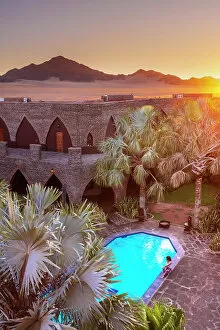 Namibia Gallery: Namibia, a swimming pool in a luxury hotel in the Namib Naukluft National Park with the sun