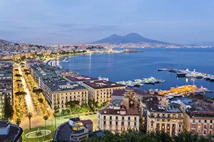 Naples Gallery: Naples, Campania, Italy. View of the bay by night and Mount Vesuvius Volcano in background