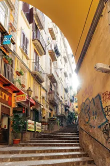 Street Lamp Prints: Naples street scene: Steps lead up past buildings, shops, and graffiti. Italy