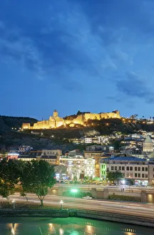 Tiflis Prints: Narikala fortress above the Old Town and Mtkvari river, at dusk. Tbilisi, Georgia