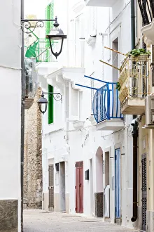 Bari Province Prints: Narrow white street in the historic centre of Monopoli, Apulia, Italy